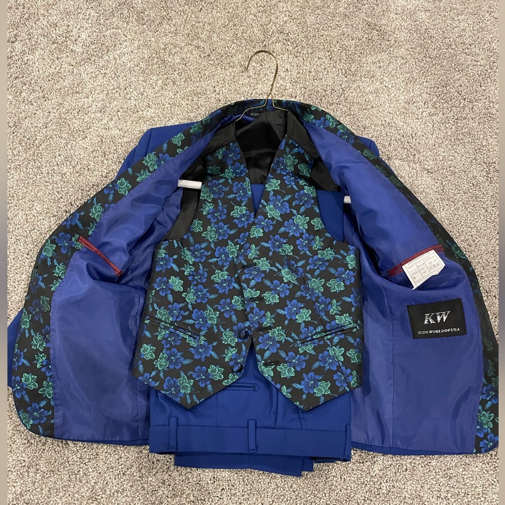 Kids, world of USA size 8 blue tuxedo lots of great details on the pockets!!